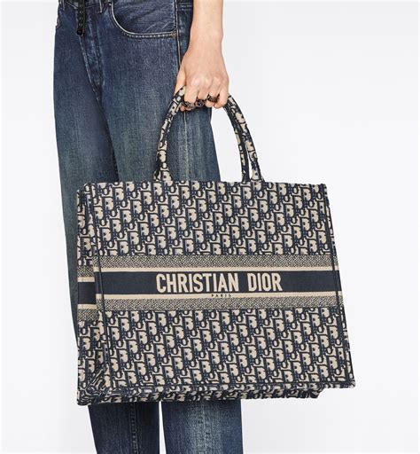 christian dior book tote gold|More.